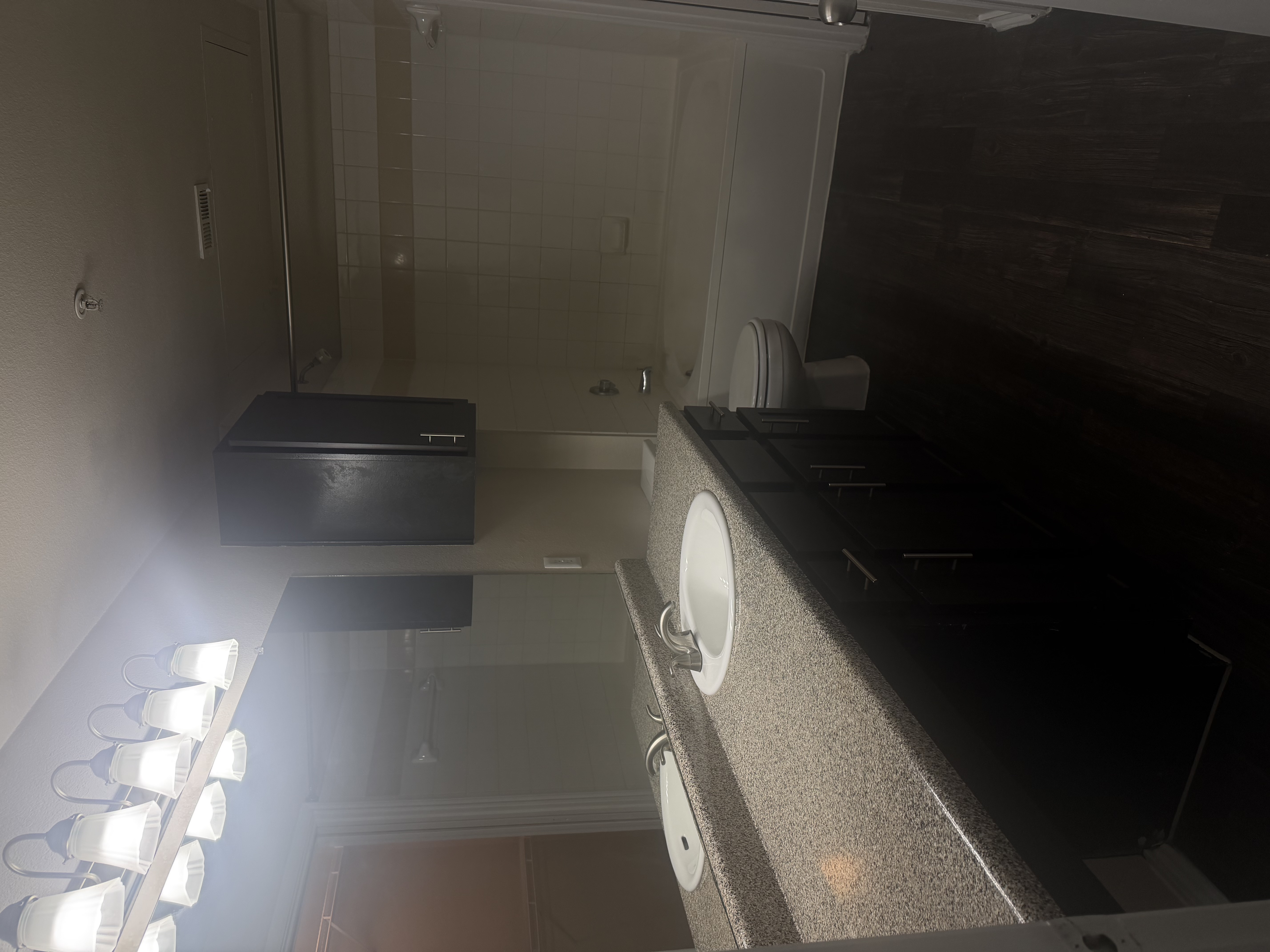 Previous bathroom sink and bath at Allura Las Colinas
